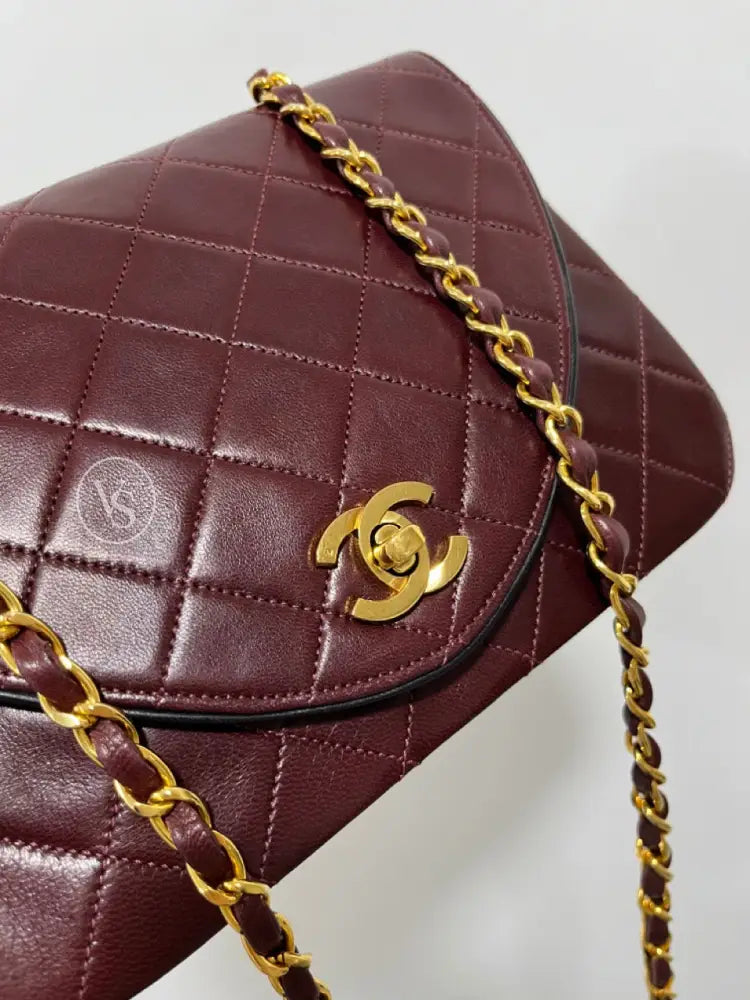 Chanel 80S Burgundy Plum Lambskin Quilted Curved Flap Shoulder And Crossbody Bag In 24K Ghw