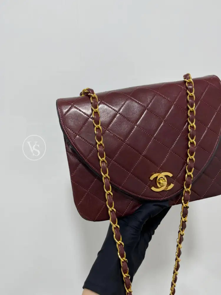 Chanel 80S Burgundy Plum Lambskin Quilted Curved Flap Shoulder And Crossbody Bag In 24K Ghw