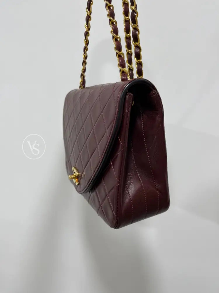 Chanel 80S Burgundy Plum Lambskin Quilted Curved Flap Shoulder And Crossbody Bag In 24K Ghw