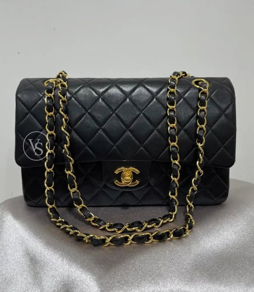 Vintage Chanel Black Lambskin quilted classic flap bag medium size in 24k gold plated hardwares 