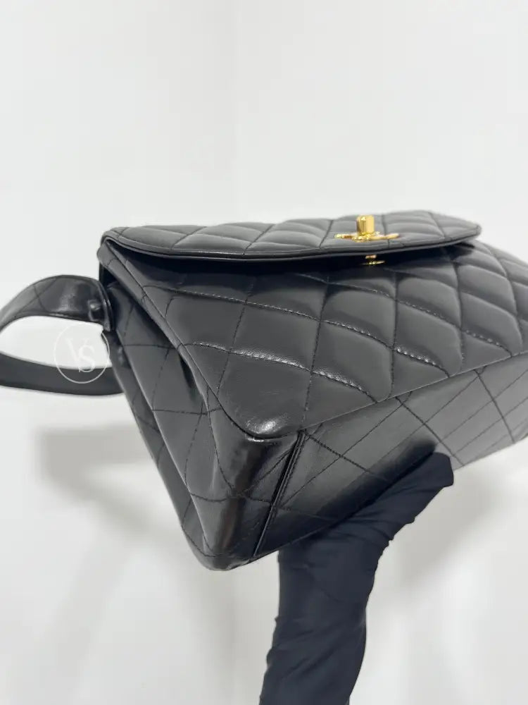 CHANEL Black Lambskin Quilted Curved Shoulder Flap Bag in 24k GHW Black