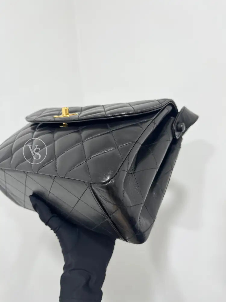 CHANEL Black Lambskin Quilted Curved Shoulder Flap Bag in 24k GHW Black
