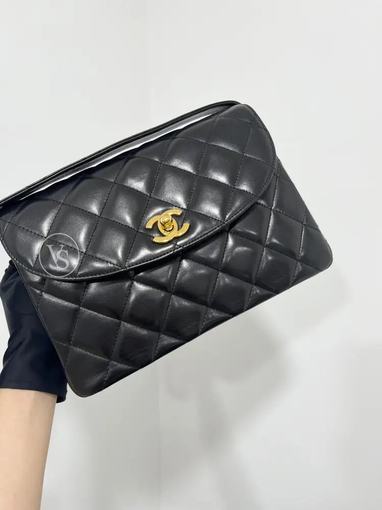 CHANEL Black Lambskin Quilted Curved Shoulder Flap Bag in 24k GHW Black