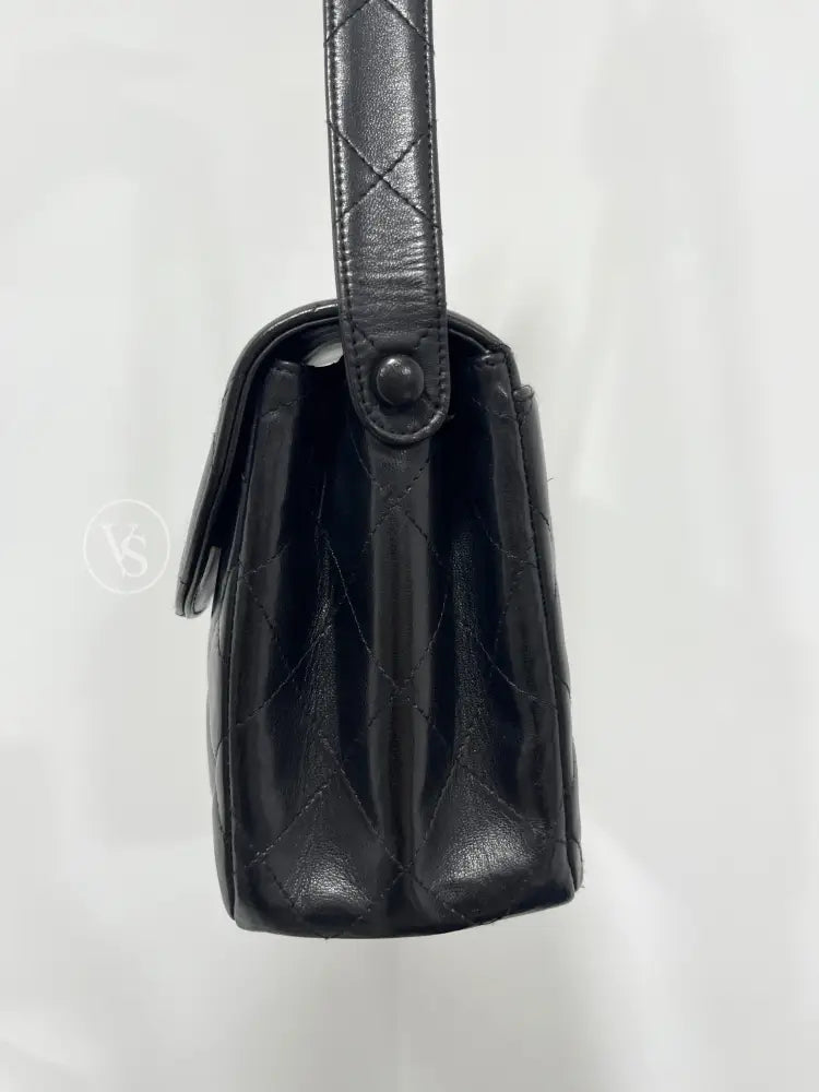 CHANEL Black Lambskin Quilted Curved Shoulder Flap Bag in 24k GHW Black